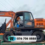 MÁY XÚC BÁNH LỐP DOOSAN DX140W